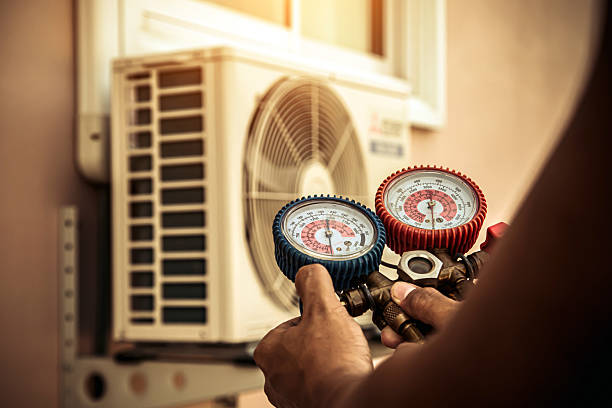 Professional Heat Pump Repair technician working in Amana, IA